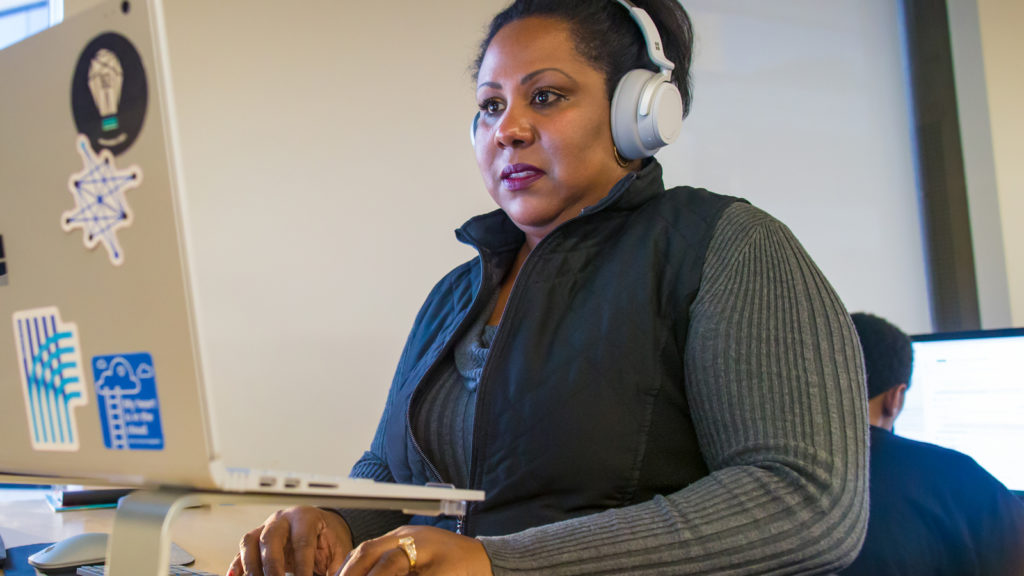 A young African American woman working on a computer